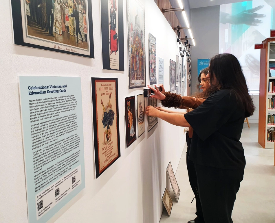 Staff and students at the exhibition exploring Poetry and Pictures in Victorian and Edwardian Greeting Cards